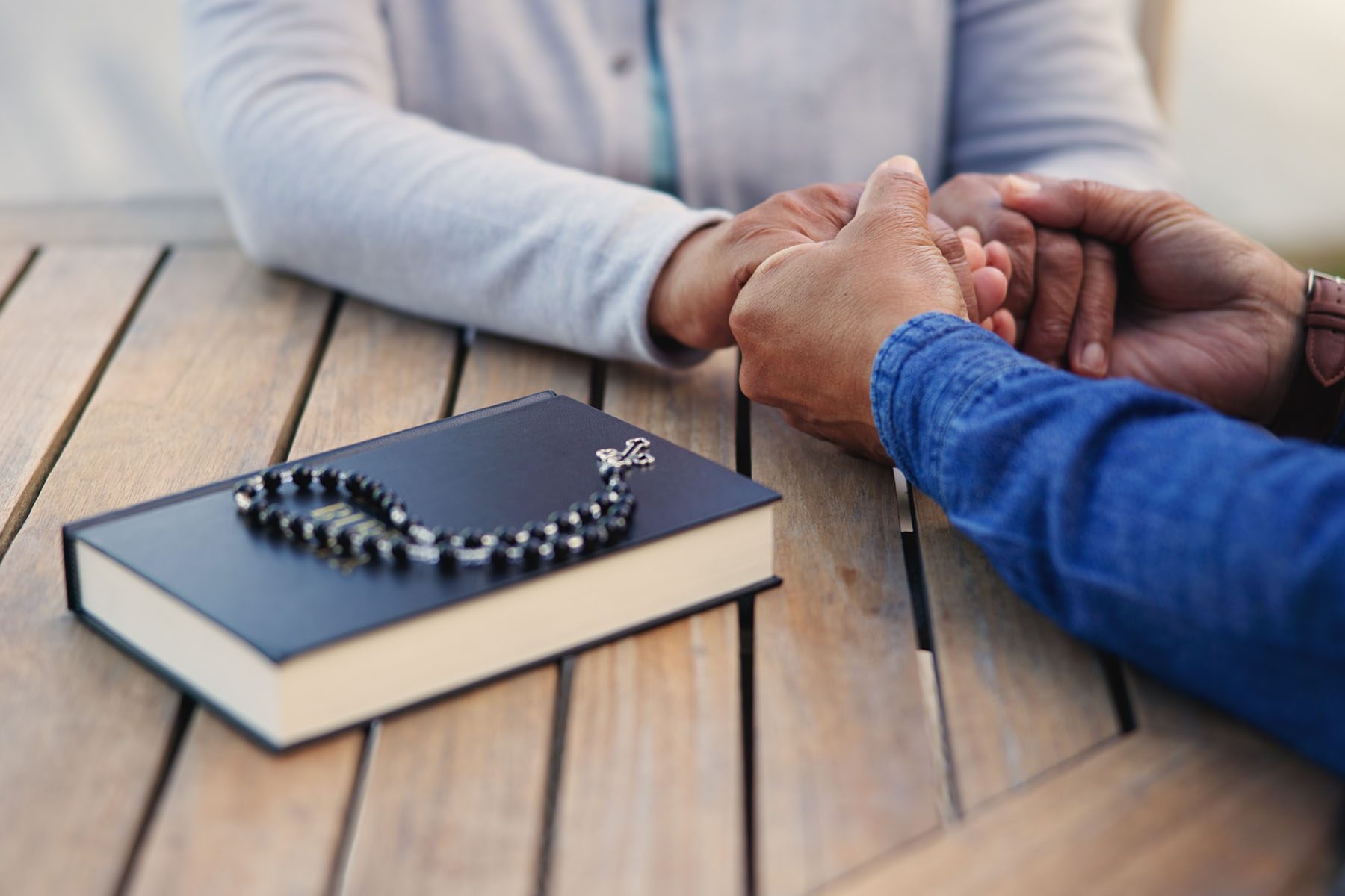 bible-praying-or-couple-holding-hands-on-table-to-2023-12-01-06-29-22-utc