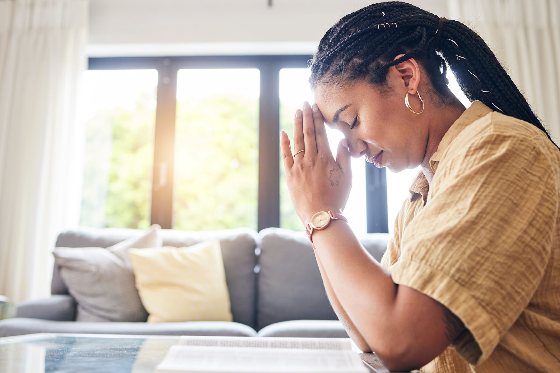 bible-worship-and-woman-praying-in-her-living-roo-2023-11-27-05-20-39-utc