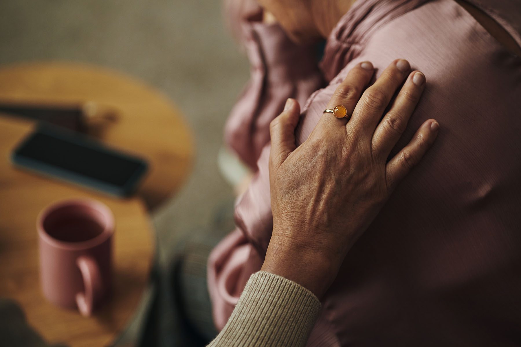 hand-of-senior-woman-comforting-elderly-friend-ind-2026-01-11-08-59-16-utc
